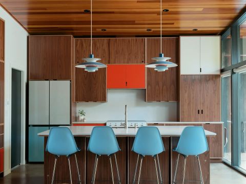 Greenville kitchen with walnut cabinetry, appliance garage with pull-out shelf, KitchenAid mixer, toaster, and food processor by Tekton Builds.