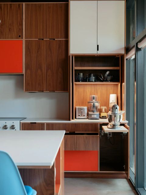 Greenville coffee bar with walnut cabinetry, LED lighting, ceramic mugs, Jura coffee machine, and gooseneck kettle by Tekton Builds.